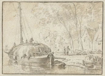 Hooischuit aan een oever