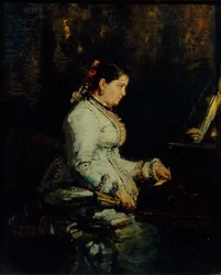 Vrouw aan een grote piano