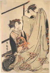 Twee schoonheden die naar een kimono kijken