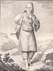 Een Arabische vrouw haalt water