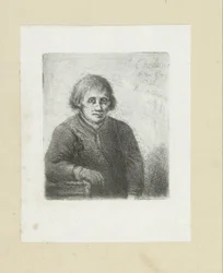 Jonge man leunend op een tafel