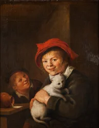 Twee jongens die met een kat spelen