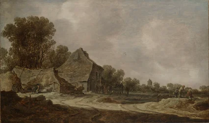 Een zandweg met rietgedekte huisjes