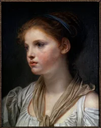 Portret van een meisje met blauwe lint