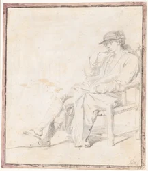 Een jonge man met hoed en kamerjas. Hele figuur zittend, naar links gericht