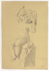 Antiek standbeeld van zittende putto met masker van Silenus