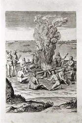 Indianen bidden rond een vuur, gravure uit Hariot