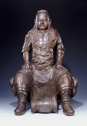Een fijne grote vroege Ming bronzen figuur van Guandi