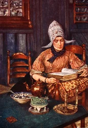 Interieur met vrouw, een boek lezend
