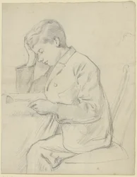 Victor Scholderer lezend aan tafel