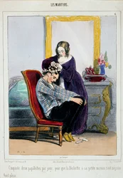 Een moeder zet krulspelden in het haar van haar zoon