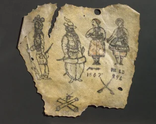 Getatoeëerde menselijke huid met figuren, waarschijnlijk Frans