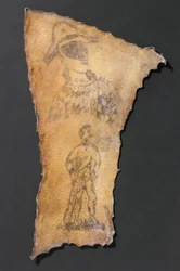 Getatoeëerde menselijke huid met harlekijn en figuur van Samson, Frans