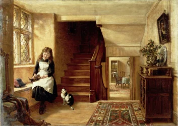 Een interieur met een meisje dat met katten speelt
