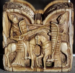 Romaans kunst: schaakstuk dat een gevecht tussen twee ridders voorstelt. Ivoren sculptuur. Uit Spanje