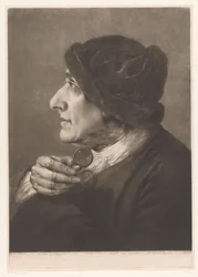 Man met een bril in zijn hand