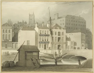 De stenen brug aan het hoofd van de kade (St Giles