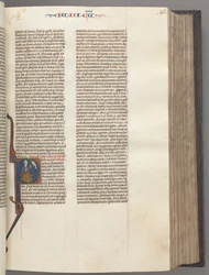 Fol. 86r, Rechters, gehistorieerde initiaal R, Juda zittend met een boek pratend met God