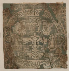 Rondel met hoekige palmetboom, van een tuniek