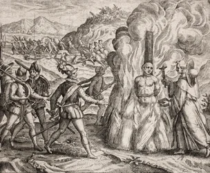 Beschrijving van de misdaden begaan tegen de Indianen door de Spaanse kolonisten - Conquistadores verbranden een Indiaan die weigerde zich tot het katholieke geloof te bekeren. Religieus van de Franciscaner Orde (gravure)