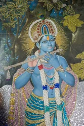 Hindoeïsme: schilderij van Heer Krishna met fluit