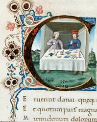 Versierde initiaal C met een paar aan tafel. Miniatuur uit de 