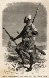 Talibe (een jonge student die de Koran bestudeert) uit het leger van koning Ahmadu (Toucouleur), in een oorlogskostuum. Gravure ter illustratie van de reis naar West-Soedan van luitenant (marine) M. Mage, in 1863-1866, gepubliceerd in 