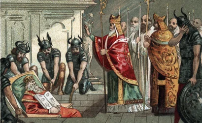 De begrafenis van Karel de Grote in 814 in de kathedraal van Aken in Duitsland. Chromolithografie uit het einde van de 19e eeuw.