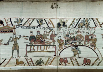 Aankomst in Engeland, de troepen van Willem de Veroveraar (1027-1087) houden een feest terwijl ze wachten om te vechten tegen de Saksische wapens van Harold II. Guillaume is omringd door baronnen en de bisschop Odon (detail)