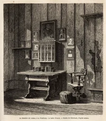 De kamer van Maarten Luther (1483-1546) in Wartburg waar hij na zijn excommunicatie in 1521 onderdak vond, met zijn portret en die van zijn ouders boven het bureau, onder wiens ogen hij de Bijbel in het Duits vertaalde en zijn beroemdste teksten schreef. D