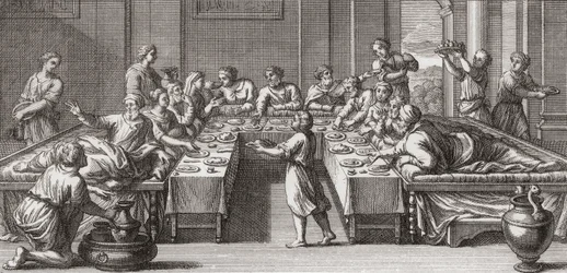 Romeins triclinium, of eetkamer, met tafel en banken
