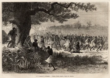 De Vouagogo (stam van Tanzania) in voorbereiding op oorlog, onder de boom, de auteur van het verhaal Henry Morton Stanley (1841-1904). Gravure ter illustratie van de reis op zoek naar Livingstone, in centraal Afrika, door Henry Stanley, correspondent van d