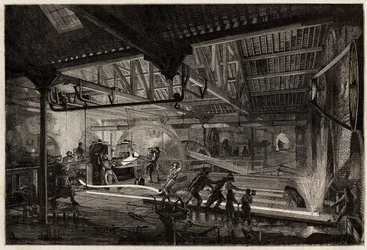 De vervaardiging van de rails in de oude smederijen van Le Creusot, de stalen strips, wit van de hitte, worden uitgerekt in rails tussen de walsen. Gravure ter illustratie van een reis naar de Creusot en de mijnen van Saone en Loire, in 1865, door L. Simon