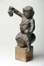 Cherub op een wijnvat
