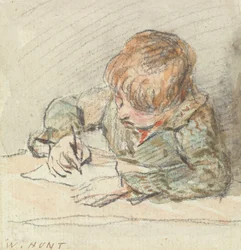 Een jongen die schrijft