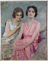 Twee jonge vrouwen zittend
