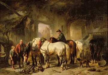 Paarden die eten in de stal